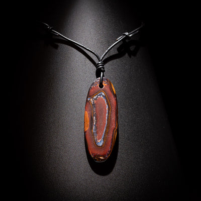 Australian Boulder Opal on leather