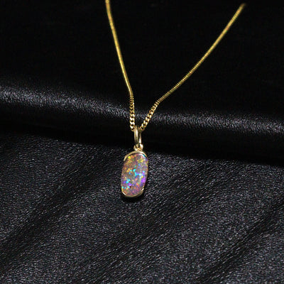 Australian Boulder opal set in 18 K gold pendant